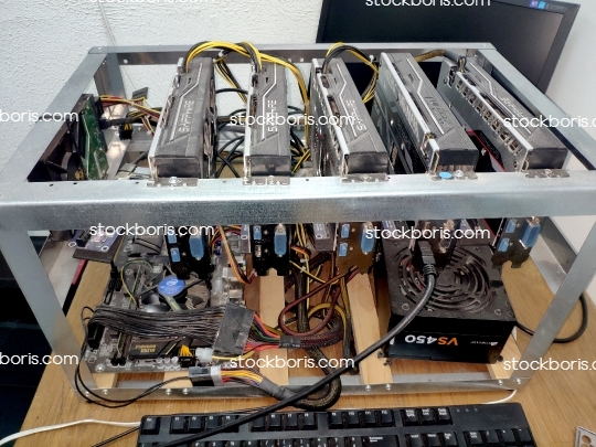 A Bitcoin cryptocurrency mining machine with 5 graphic cards