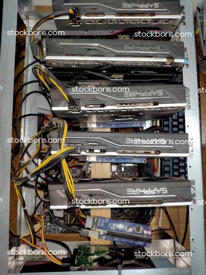 A Bitcoin cryptocurrency mining machine with 5 graphic cards