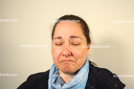 Almost crying woman with a scarf.