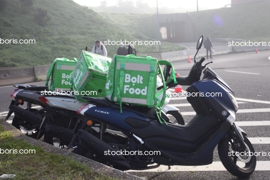 Bolt food delivery courier motorcycles parked. Lisbon 20/12/2020.