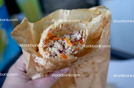 Brazilian pastry at a market. Chicken and carrots fill.