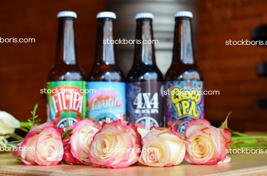 Craft beer bottles with flowers during international women\'s day.