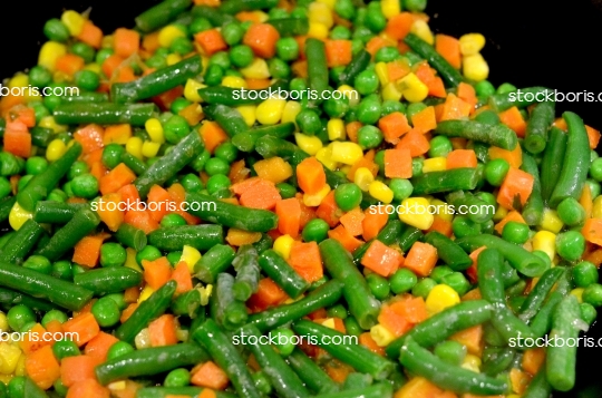 Green pods, carrots, corn and peas sallad.