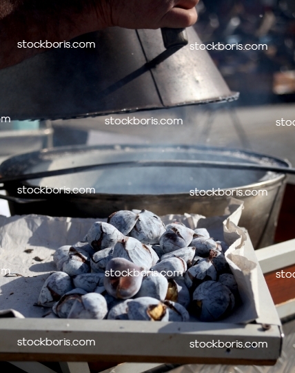 Portuguese chestnuts roaster with lots of smoke.