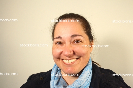 Smiling woman with a scarf.